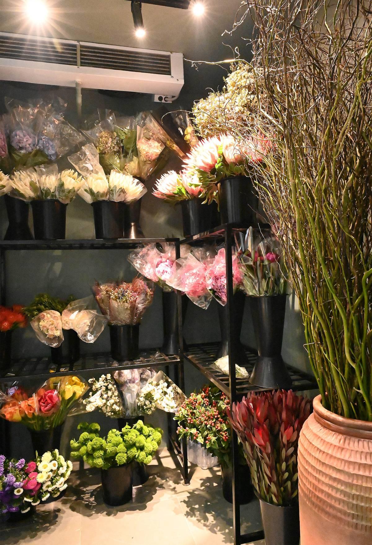 Florist arranging a bouquet at the studio workbench