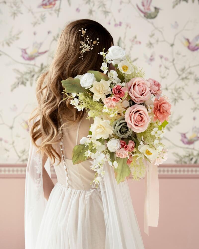 Blush bridal bouquet with peonies and ranunculus