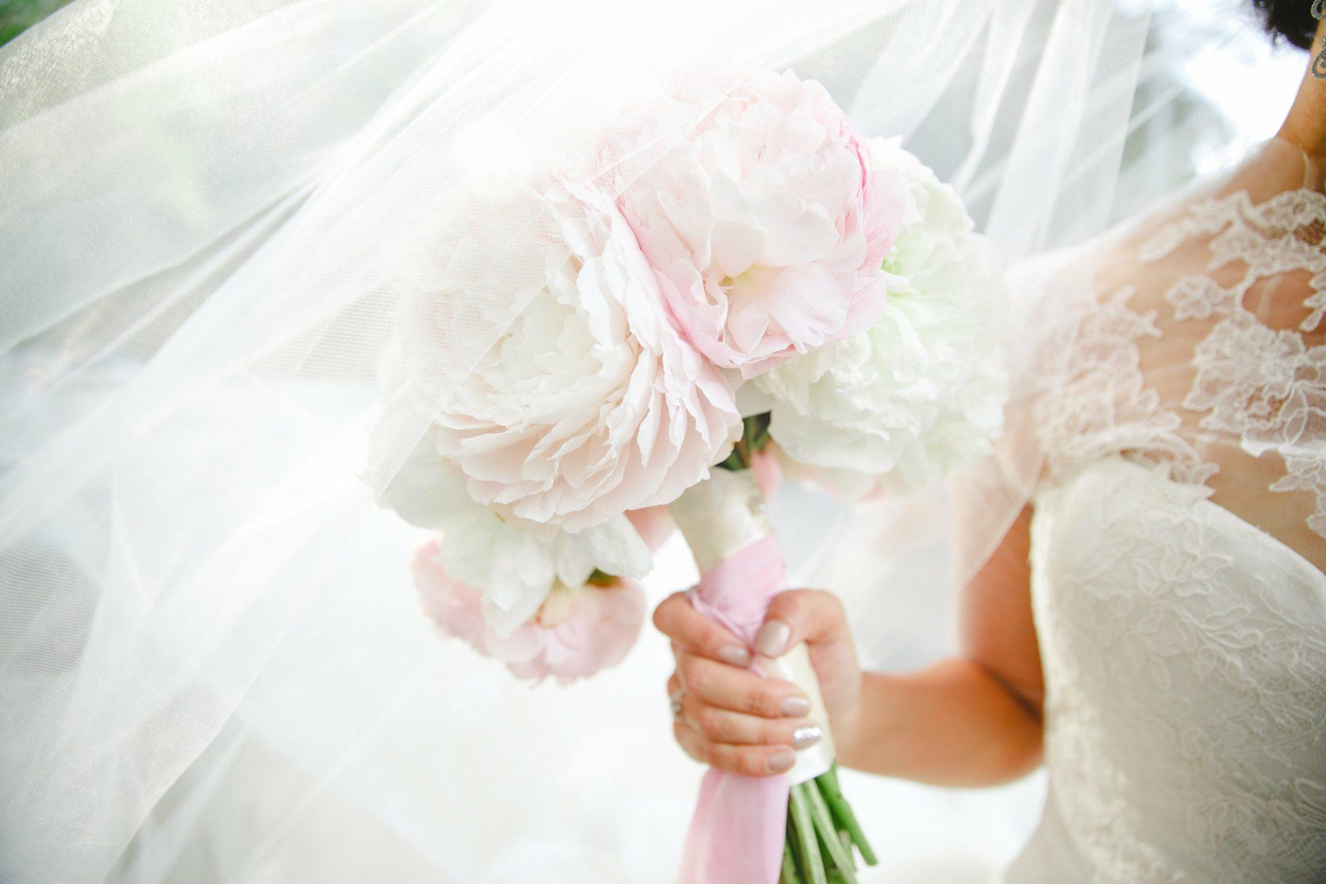 Bridal cascade bouquet of white and blush roses