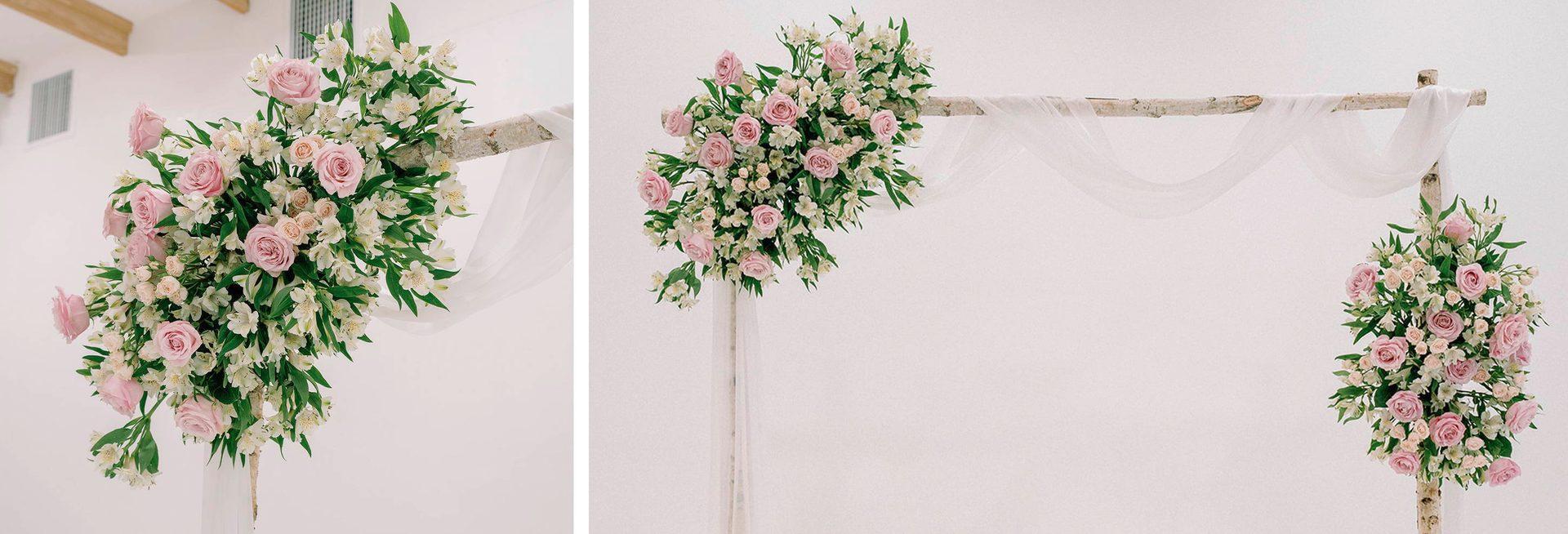 Wedding aisle lined with floral arrangements