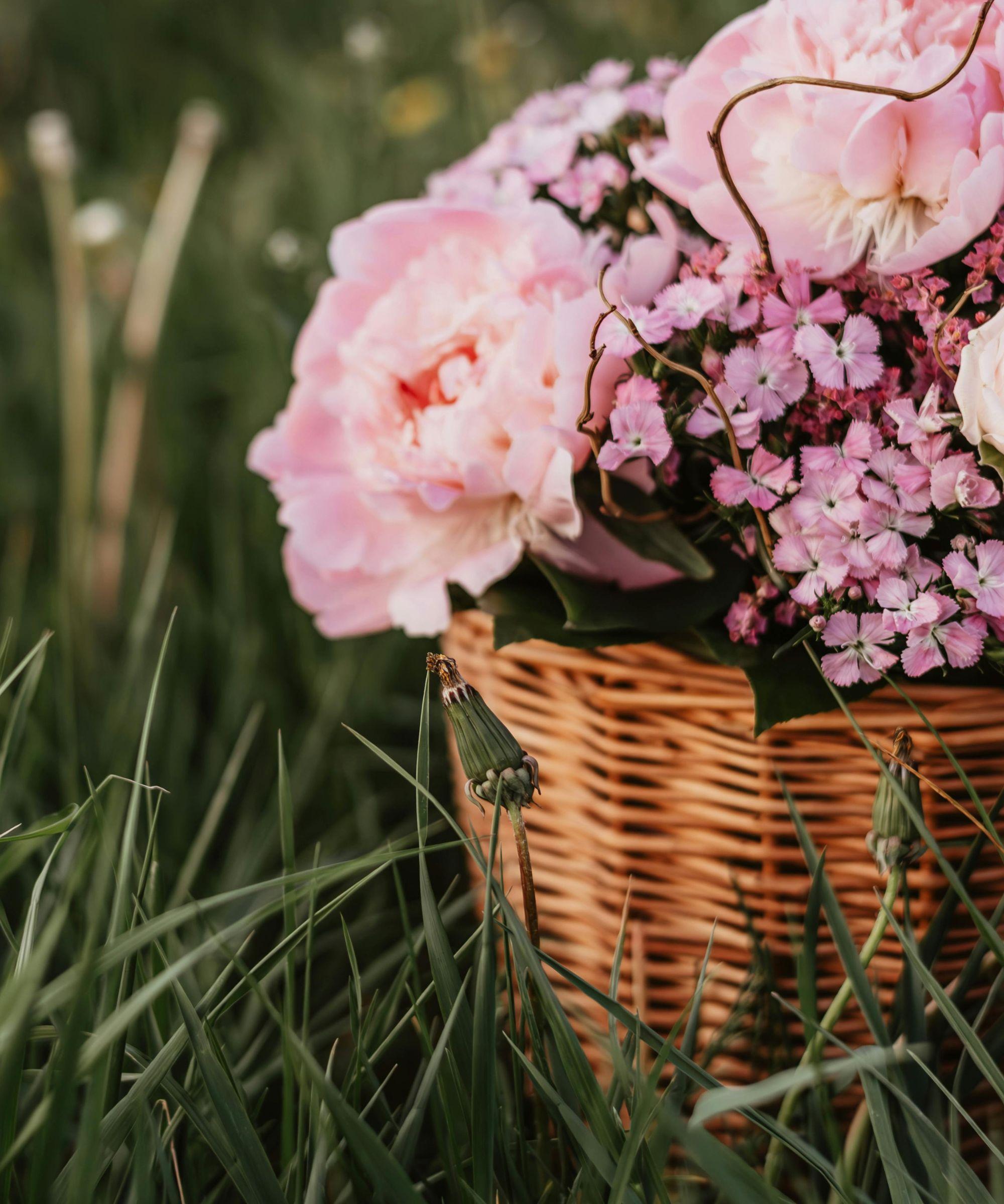 Abundant garden-style floral arrangement in soft pastel tones
