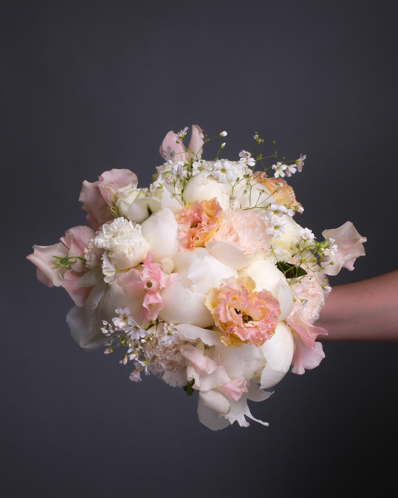 Lush pink peonies at full bloom in soft natural light