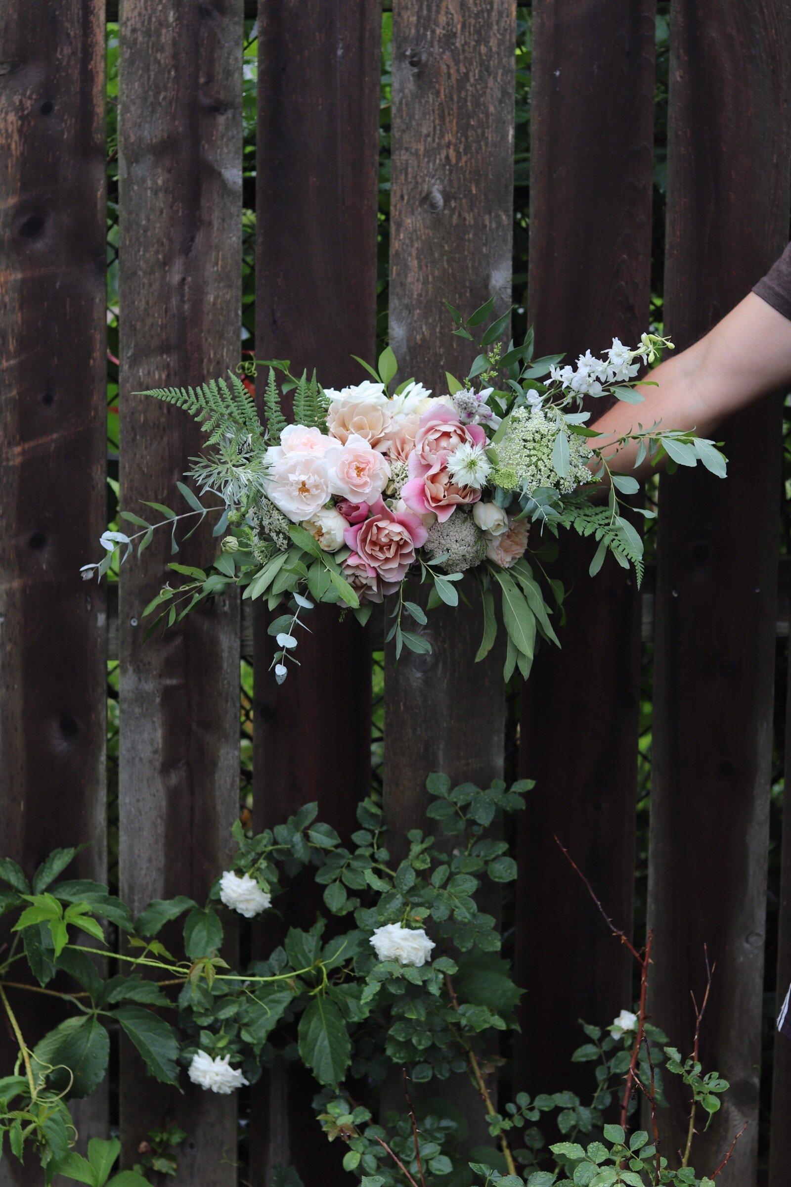 Colorful rustic wildflower bouquet with garden texture